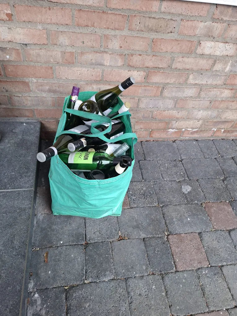 A reusable GlassBag filled with bottles and jars, the glass that falls outside the Irish Deposit Return Scheme.